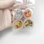 Crushed metallic foil leaves (patal)