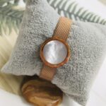 Gold Watch Bracelet with a White Stone Face